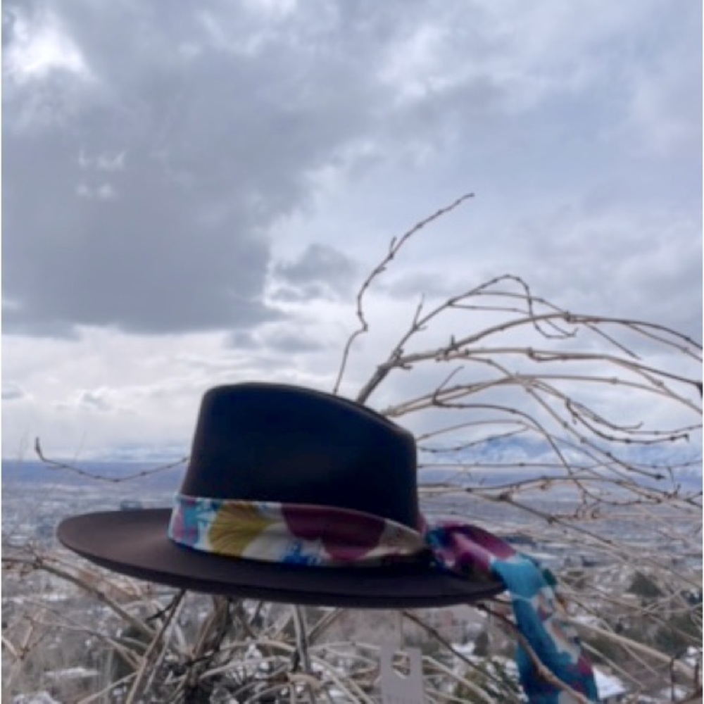 Wool fedora by Wyeth, decorated with removable silk scarf.